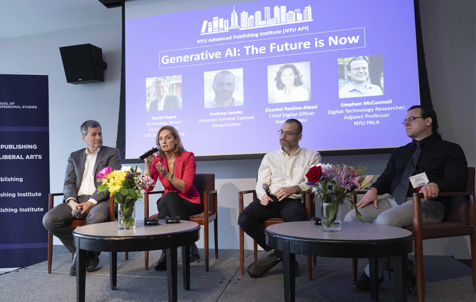Panelists sit onstage