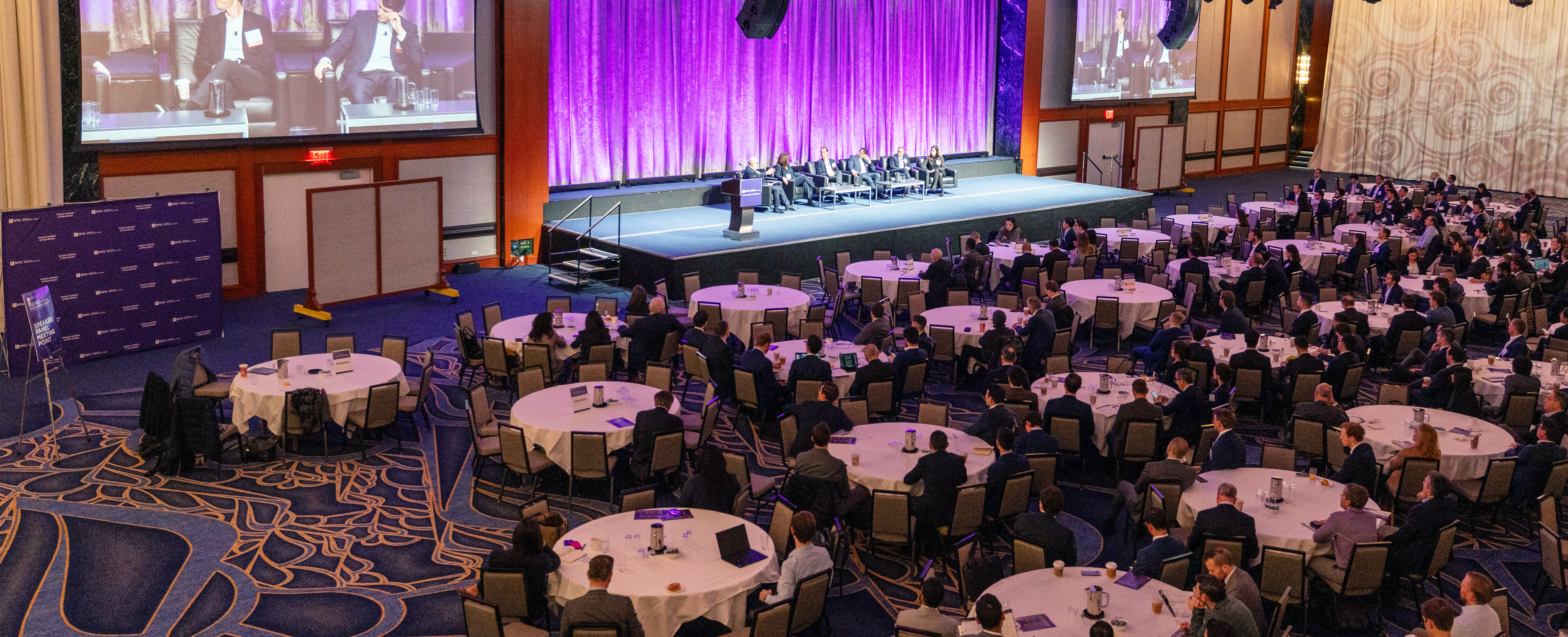 Conference on Capital Markets in Real Estate floor lookin at the stage