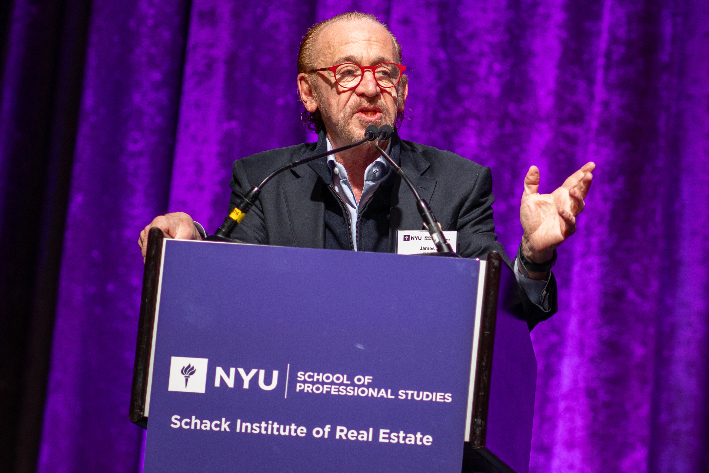 James Kuhn of Newmark and NYU Schack Advisory Board Chair addresses attendees and Schack students at the 2023 NYU Capital Markets Conference attendees. 