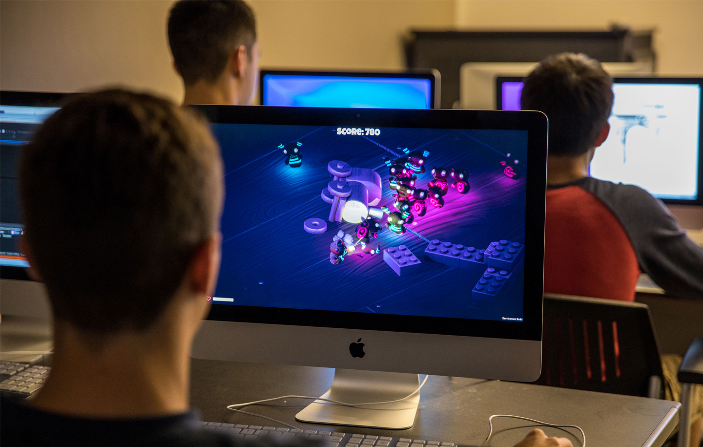 Students look at computer screens.