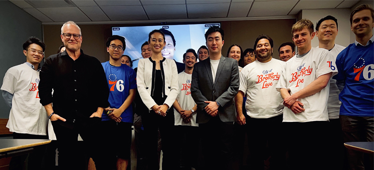A group of NYU SPS students gathers for a photo, all smiles and energy.