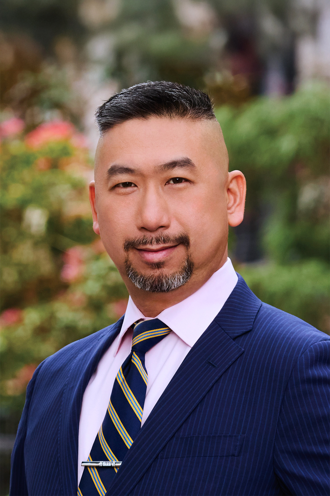 NYU SPS CE instructor Joseph Ng smiles for a headshot